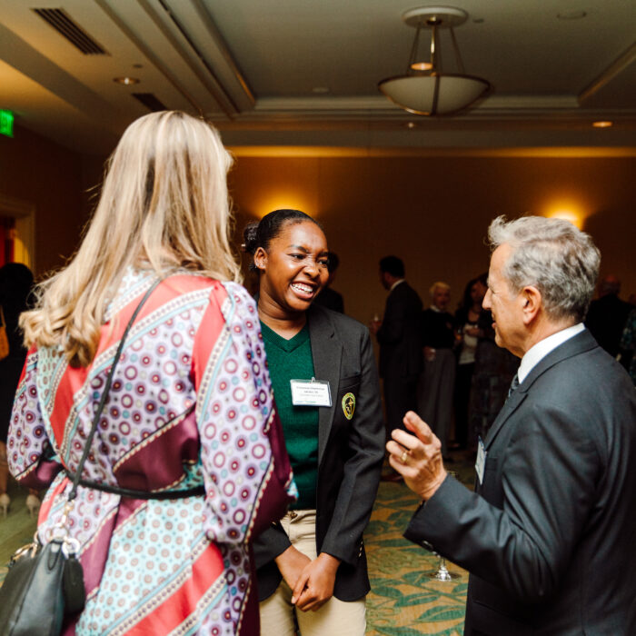 Cathedral Scholar talking to the guests at the AASF Gala