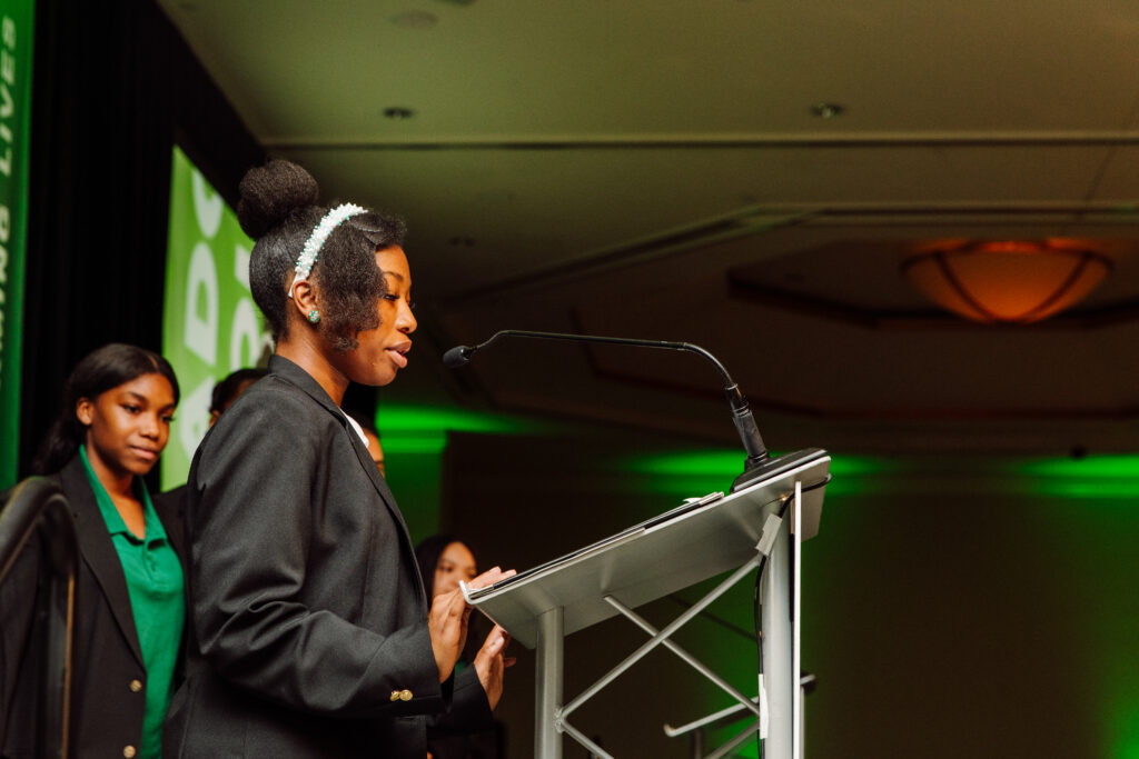 Cathedral Scholar at Adopt-A-Student Foundation Gala giving a speech