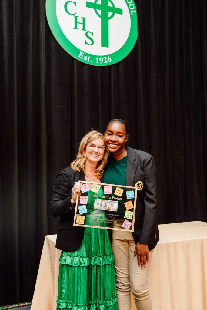 Cathedral scholar with Katie Sullivan presenting her with the a gift of appreciation for The Benjamin Project