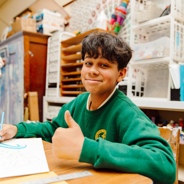 Cathedral scholar giving a thumbs up